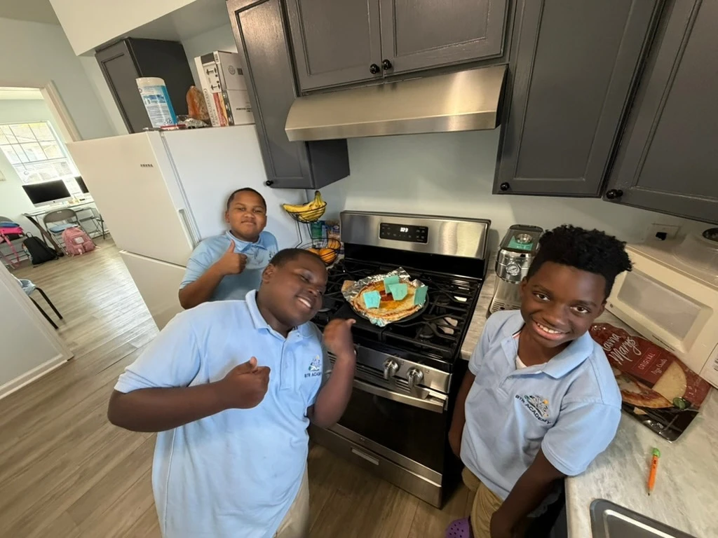 Students present their Earth-layer pizza project