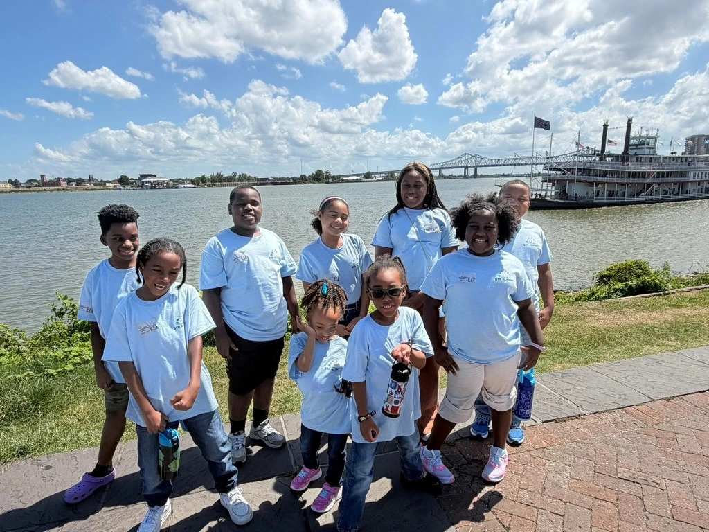 BTR Academy students together on a riverside field trip